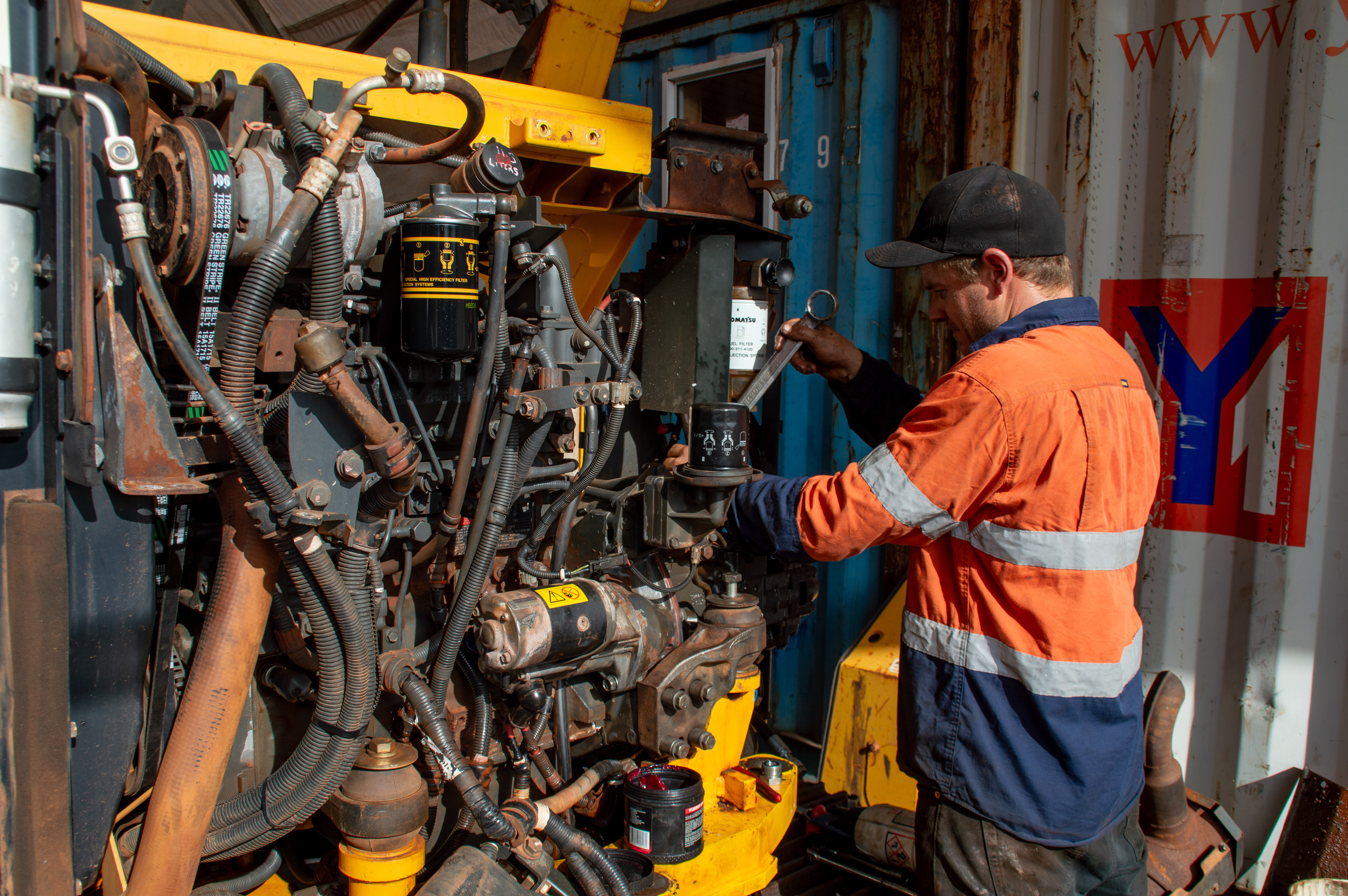 Heavy plant mechanic servicing earthmoving equipment